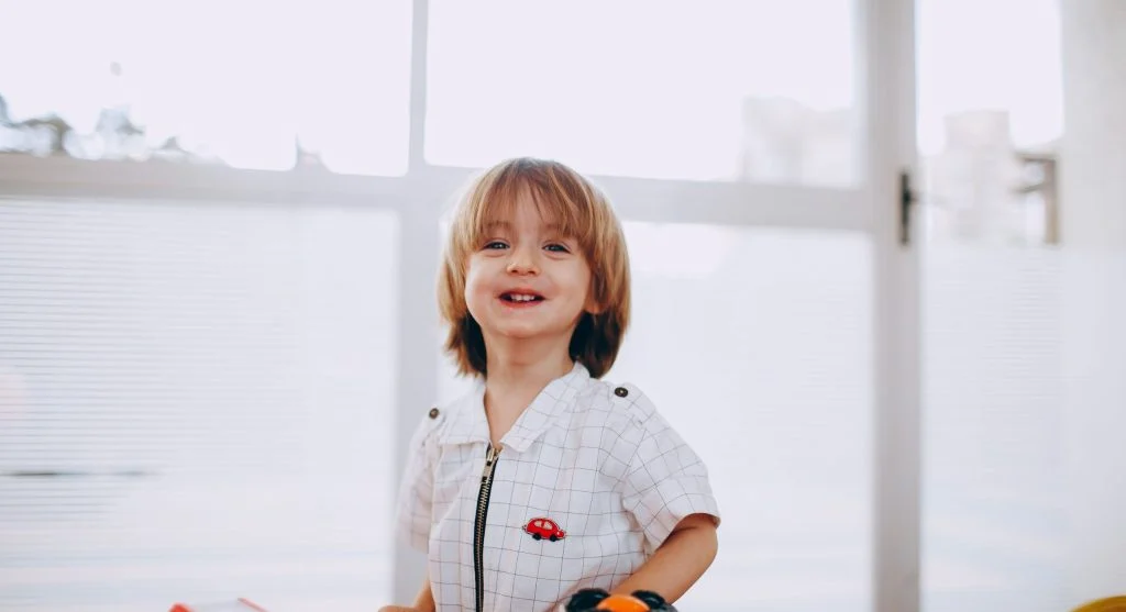 Child feeling successful after an easy start to the dressing routine