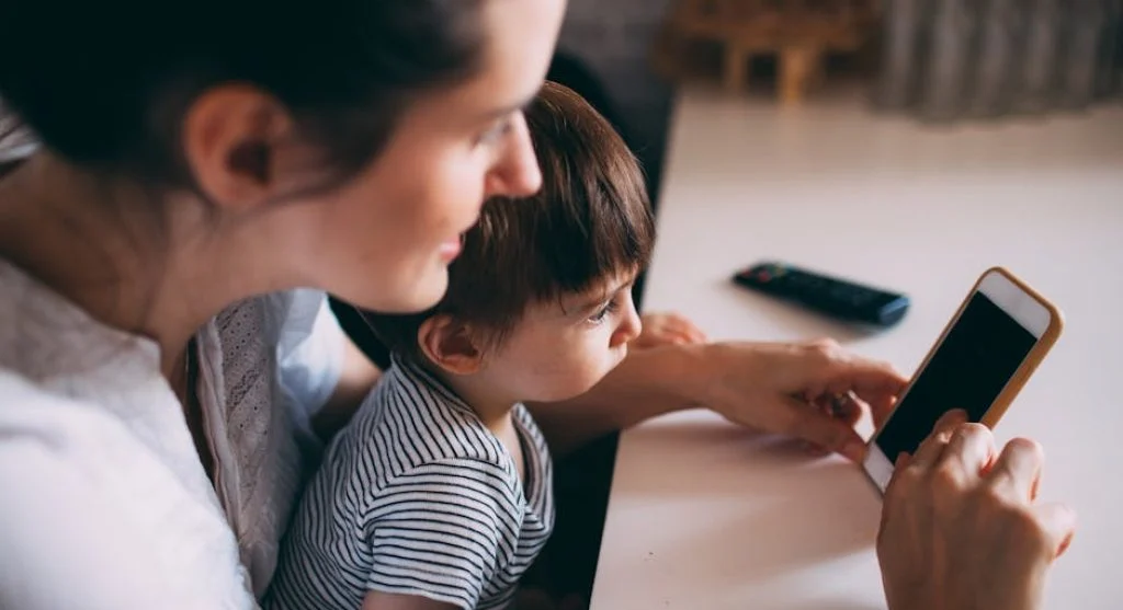 parent playing with happy child