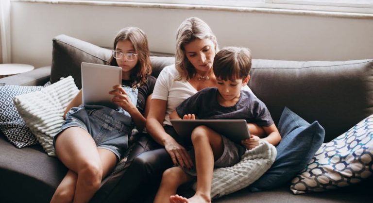 family using devices together