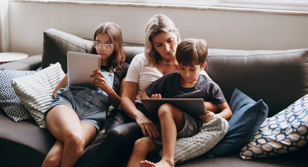family using devices together