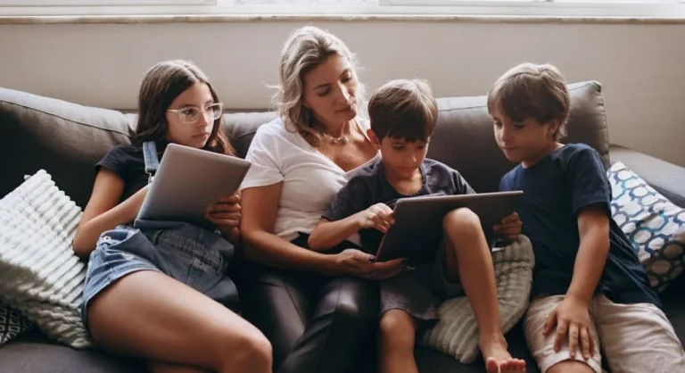 Parents and children engaging in screen time together, debunking common myths