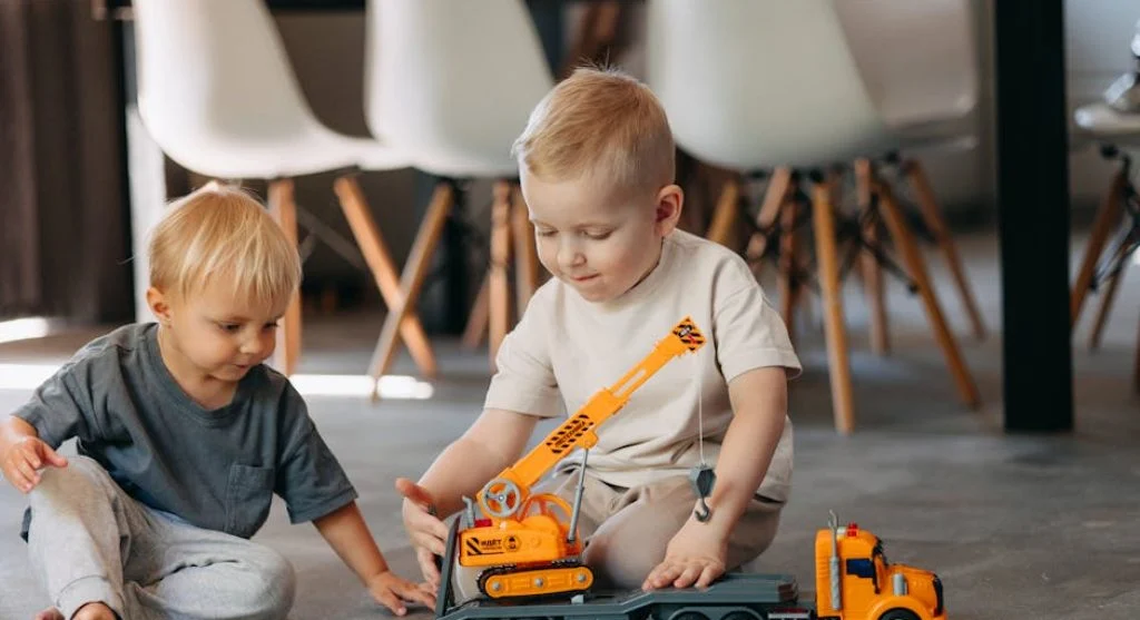happy kids sharing toys together