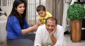 Child wanting control during play while a parent stays calm nearby at home