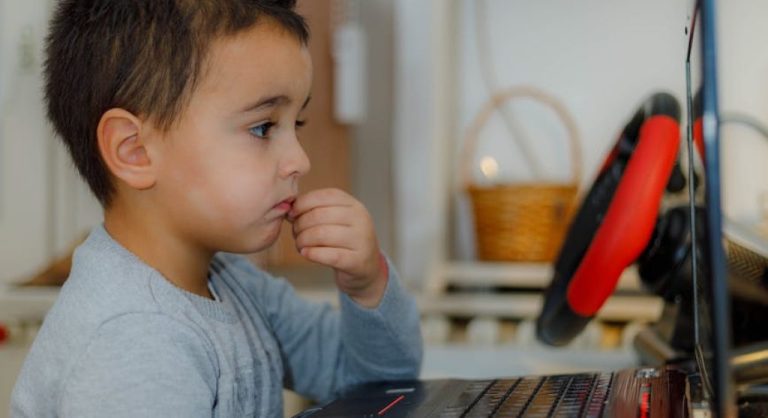 child reading book with curiosity