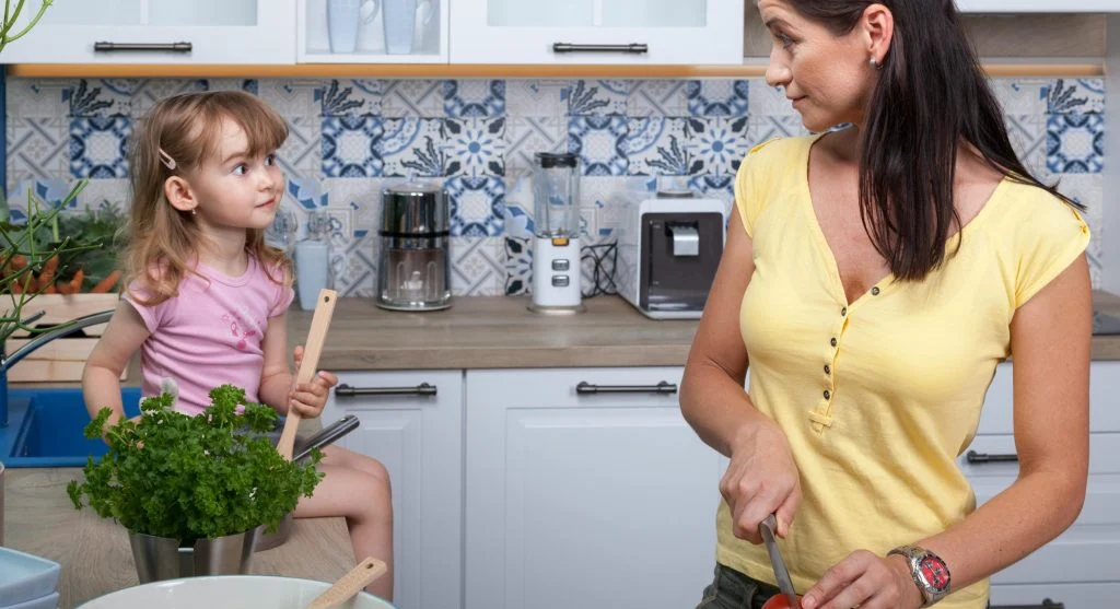 parent child cooking in kitchen