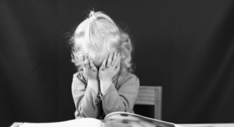 upset kid with arms crossed