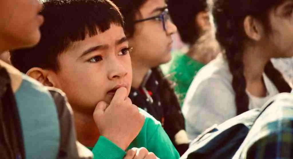 Child thinking carefully while explaining the intention behind a mistake