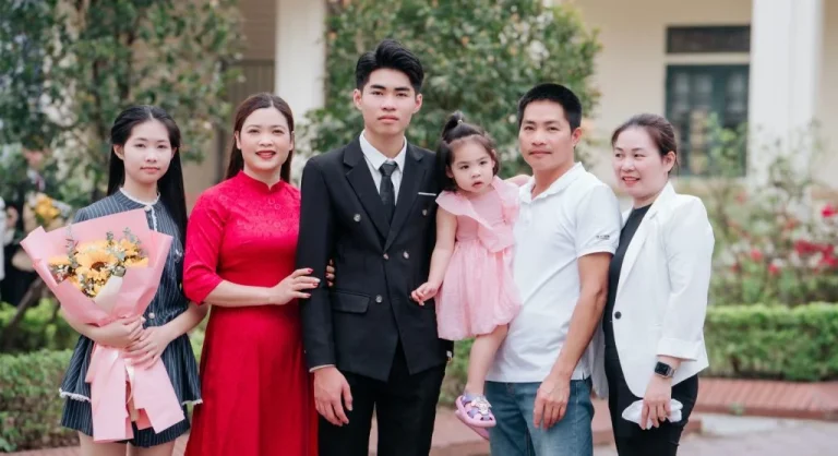 Family ending a home tradition with a familiar closing phrase together