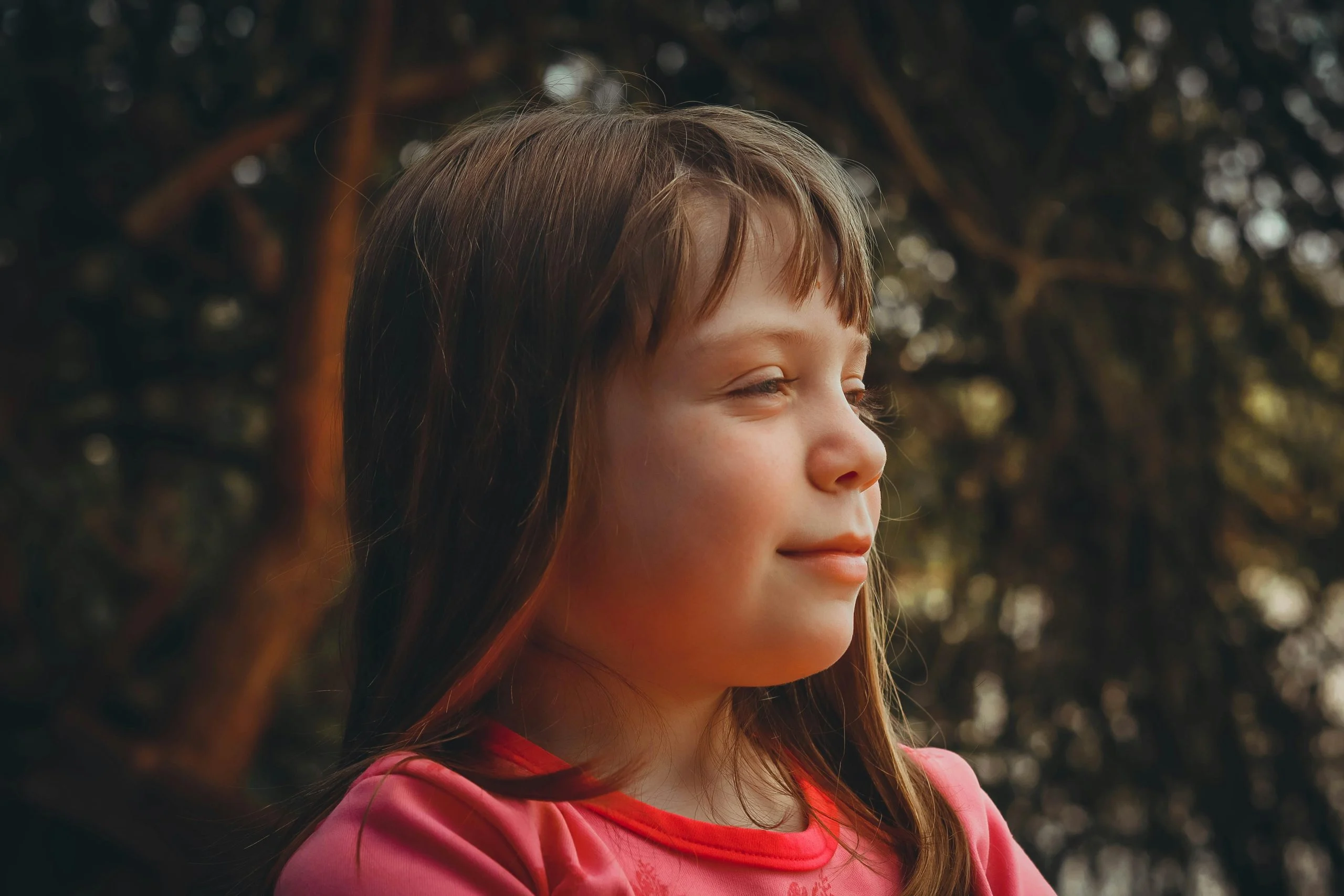 kid taking deep breath outdoors