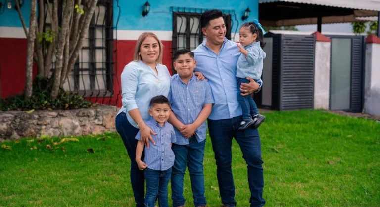 Family sharing a tradition where each person has a small role at home