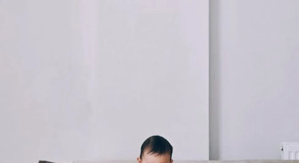 kid playing with clock toy