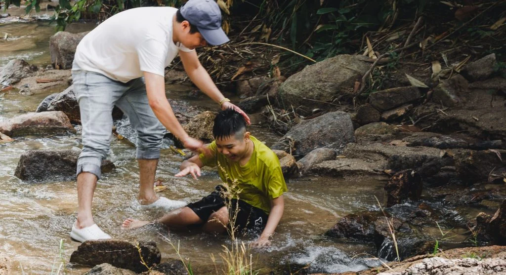 Parent quietly helping a child move on after a small embarrassing moment