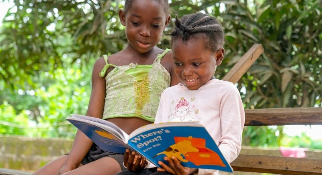 children reading books together