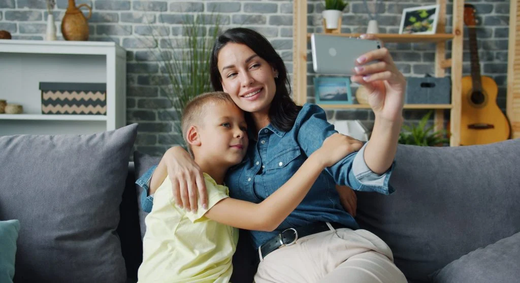 Parent and child sharing a small repeated family ritual at home