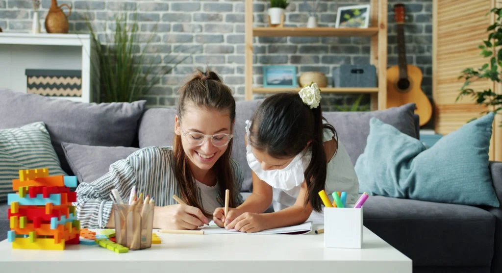 Parent calmly guiding a child about wording and tone during conversation