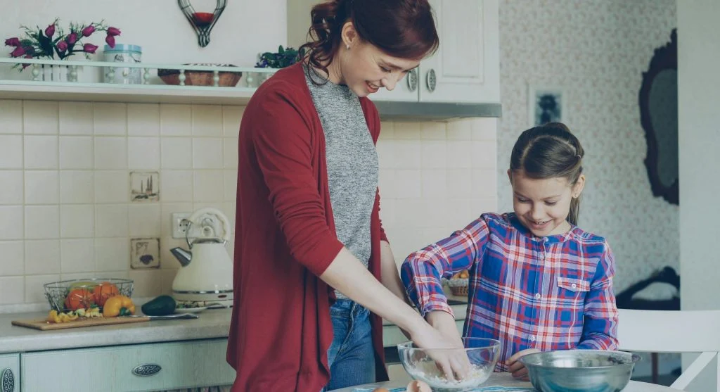 Child following a clear next-step direction from a parent at home