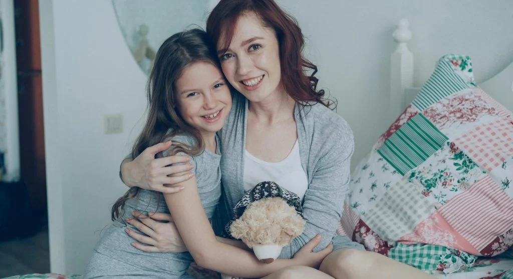 Parent helping a child through a predictable waiting moment at home