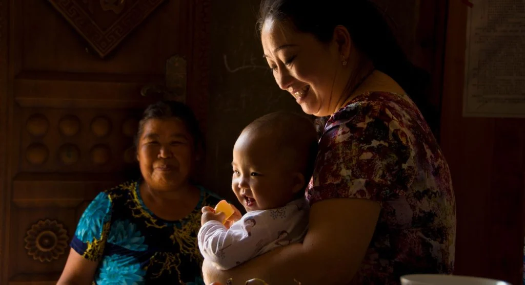 Child taking on a bigger role in a family tradition at home
