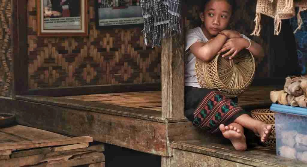 Child reacting happily to a familiar basket used for a family tradition