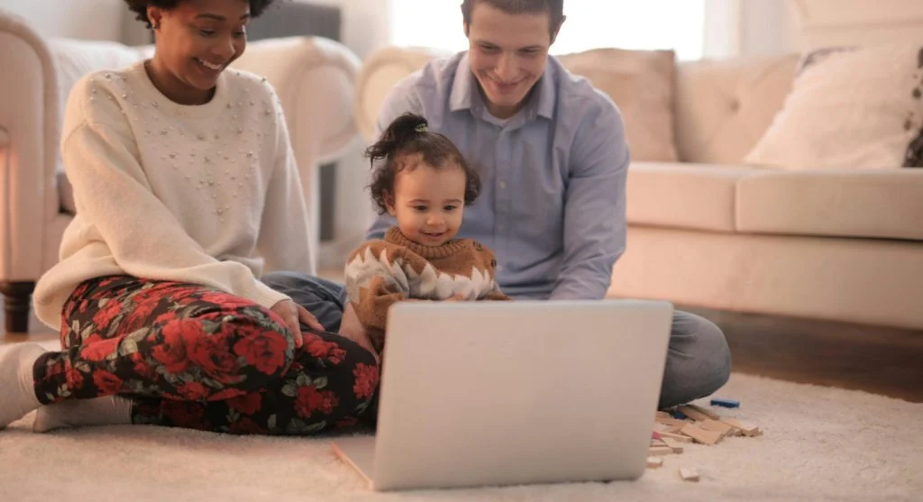 Parent ending a child’s screen session in one shared family viewing area