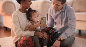 Parent calmly ending a child’s short phone turn at home