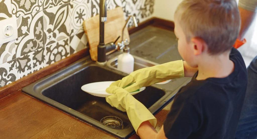 kid helping at home
