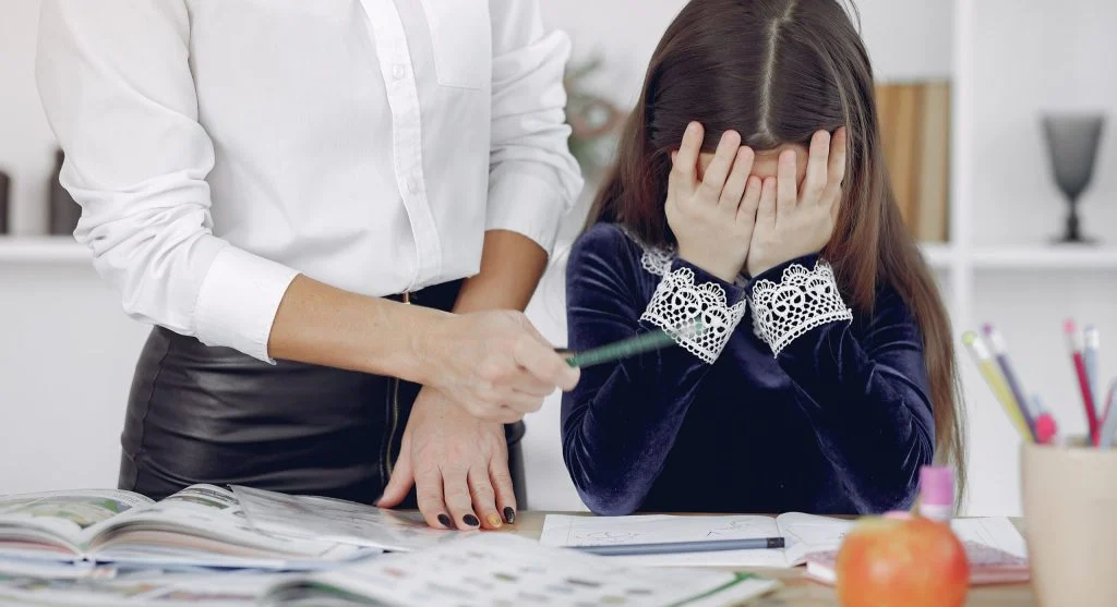 Child noticing embarrassment after a small mistake at home