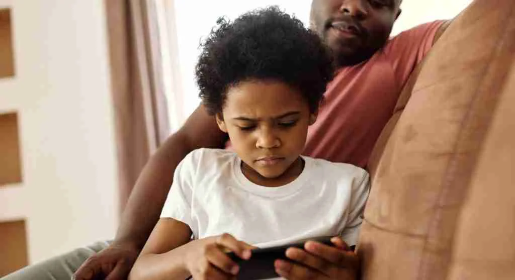 Parent lowering device volume before ending a child’s video at home