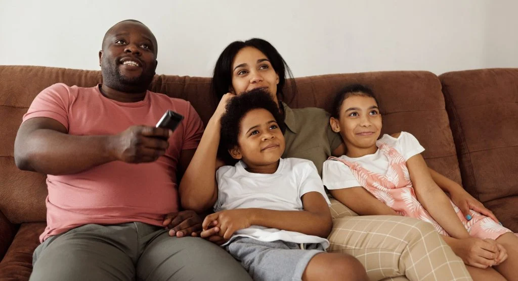Parent reviewing a family TV choice order before shared viewing begins