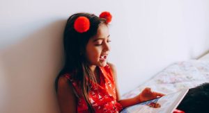 kid using digital tablet