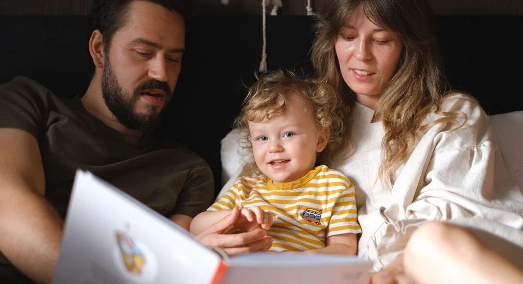 Child explaining one remembered idea from a book after reading at home