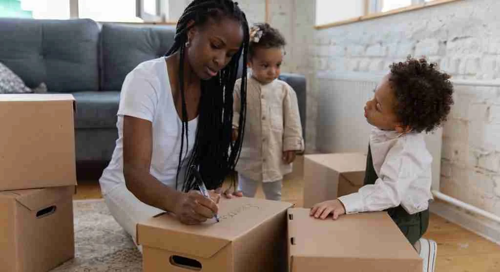 Adult helping children move forward after an apology at home