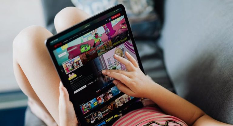 kid using tablet with education apps