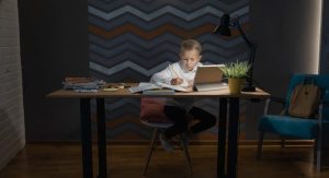 kid studying at desk