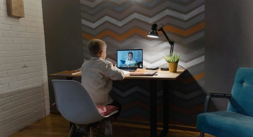 child listening to worksheet instructions