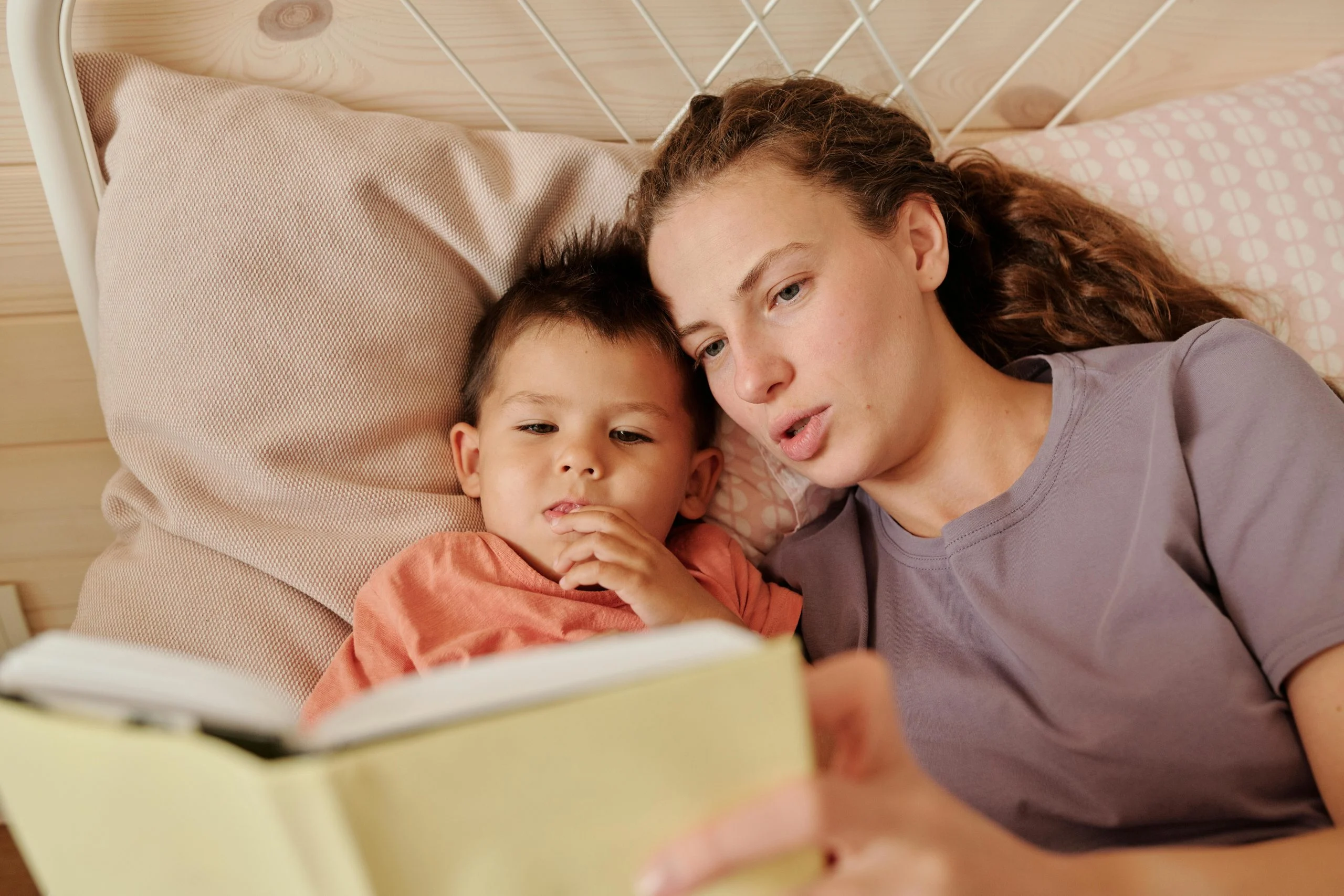 mom reading book to kid