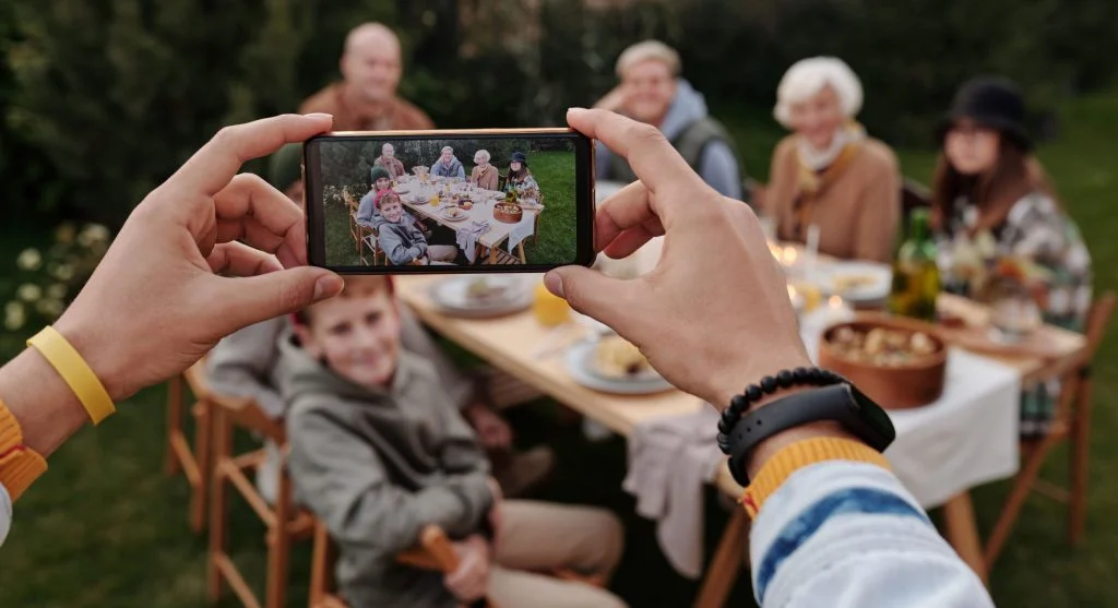 Family using one shared basket for devices before mealtime