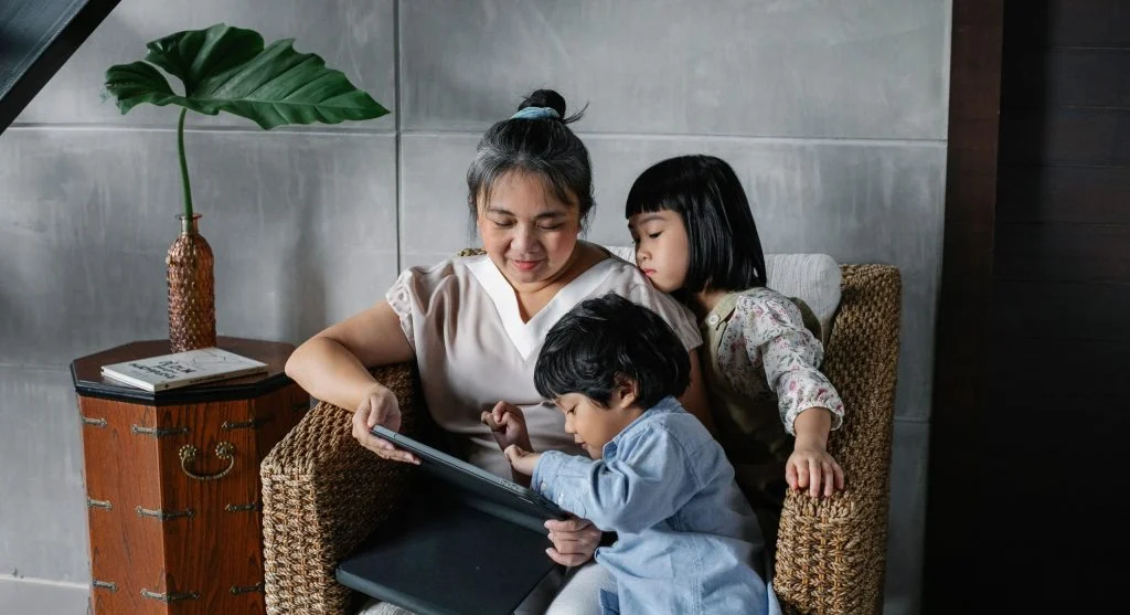 Parent putting a shared device in its usual home spot after screen time