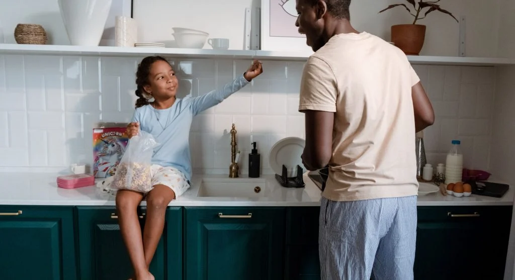 Parent explaining the next two minutes of a routine to a child at home