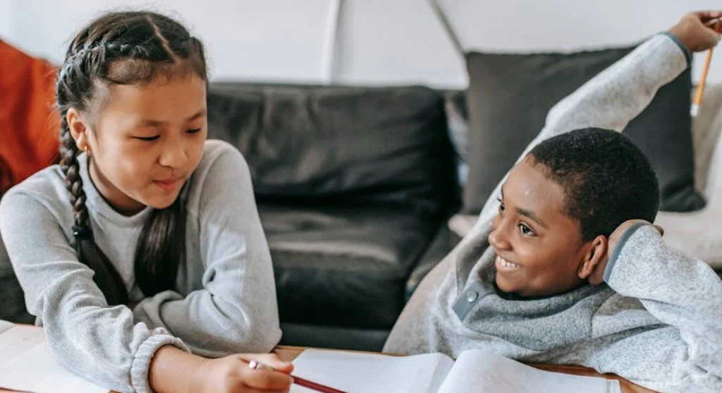 kids studying at desk with books