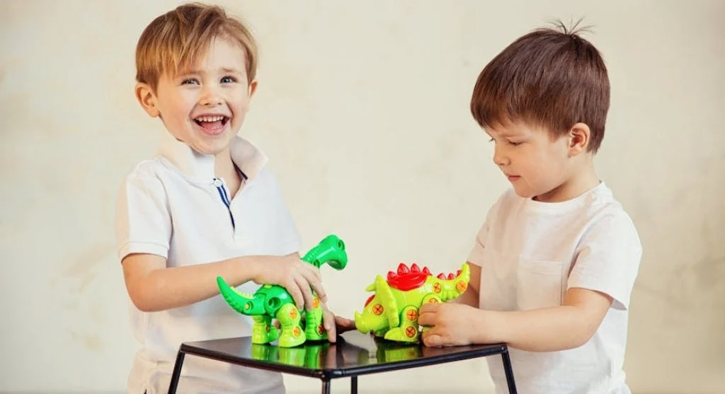 kid playing with colorful toys