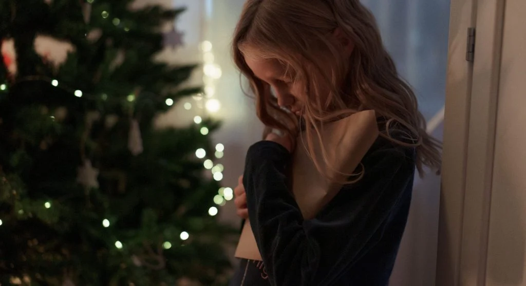 Child noticing a familiar object that signals a family tradition is starting