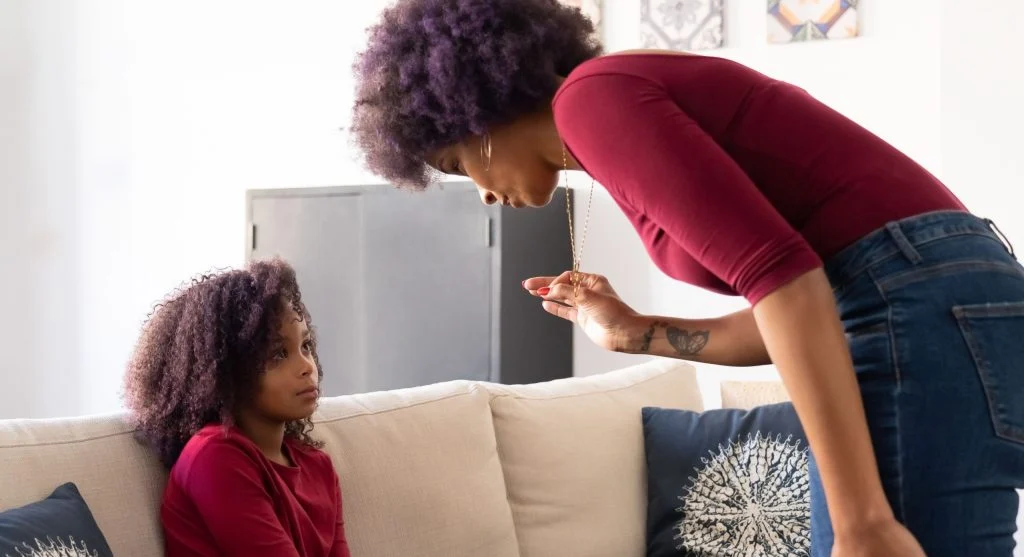Parent listening as a child adds events in order while talking about the day