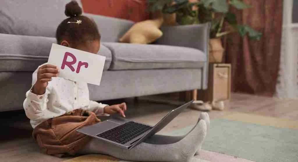 Child focusing on three uppercase and lowercase letter pairs during home learning