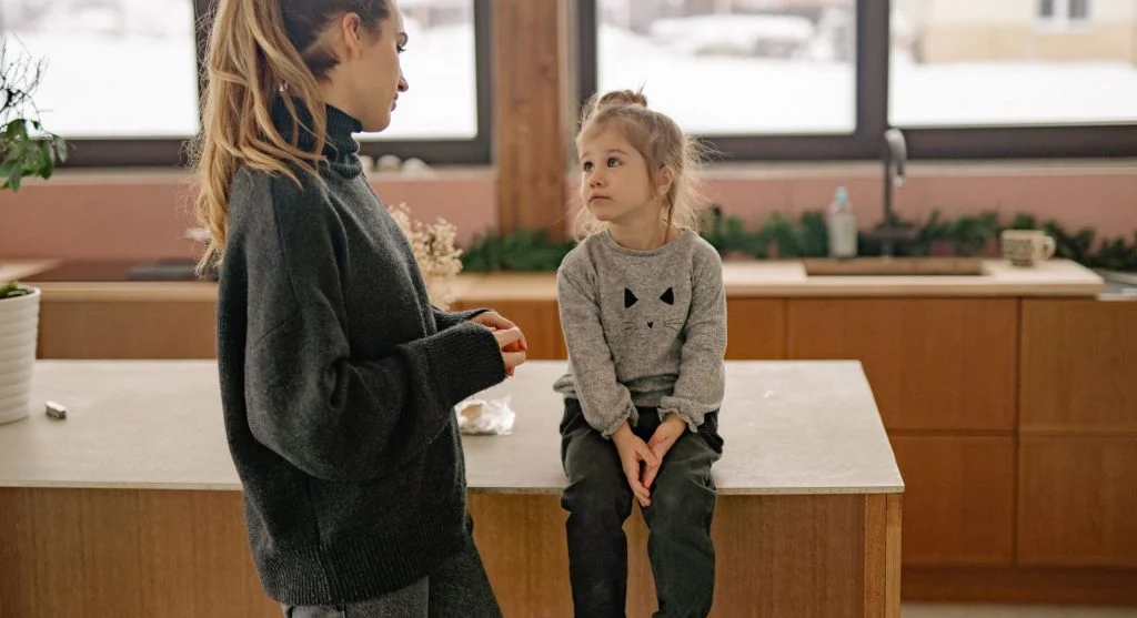 Child answering one small clear question during a calm home conversation