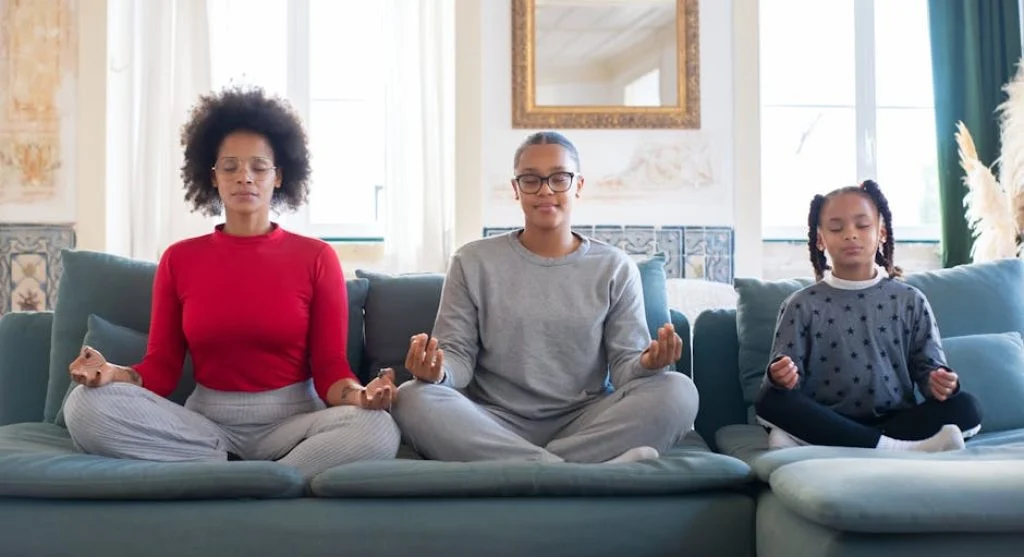family practicing yoga together