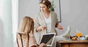 Child explaining an argument while a parent listens calmly at home