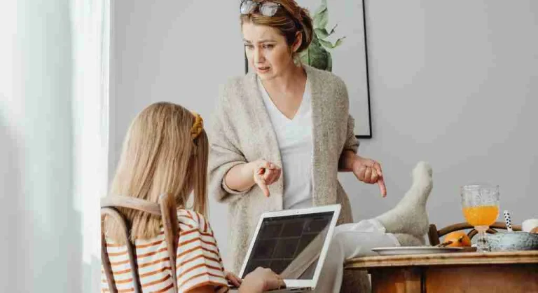 Child explaining an argument while a parent listens calmly at home