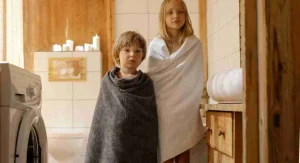 Child seeing a ready towel before washing hands at home