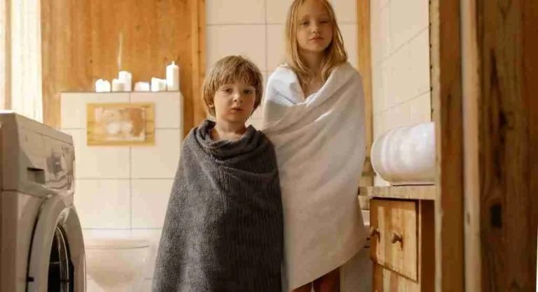 Child seeing a ready towel before washing hands at home